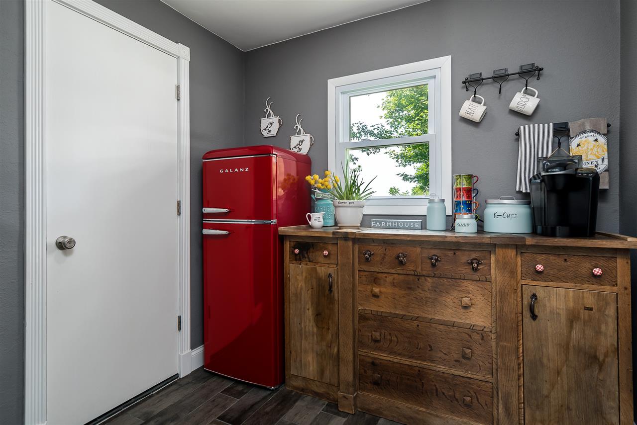 9691 East Cedarville Road Davis, IL 61019 - Photo 26 of 39 a kitchen with a refrigerator and window