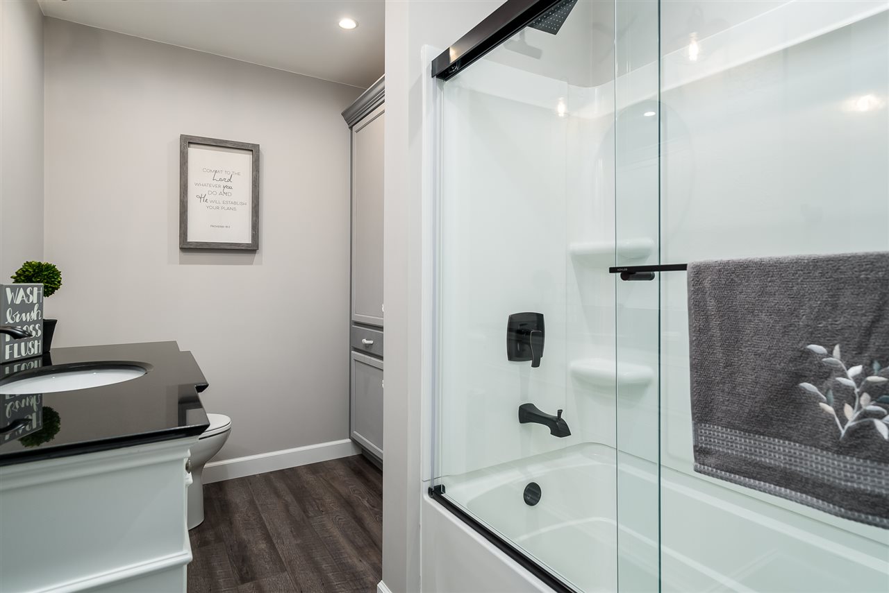 9691 East Cedarville Road Davis, IL 61019 - Photo 32 of 39 a bathroom with a bathtub and a shower