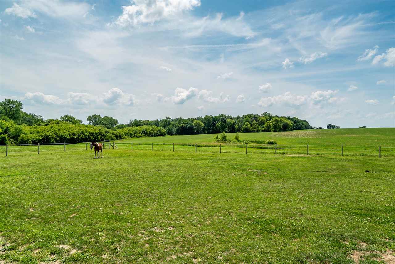 9691 East Cedarville Road Davis, IL 61019 - Photo 7 of 39 a view of a golf course with a garden