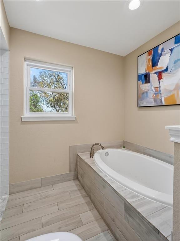 3863 Clayton Road East Fort Worth, TX 76116 - Photo 25 of 39 a spacious bathroom with a bathtub and window