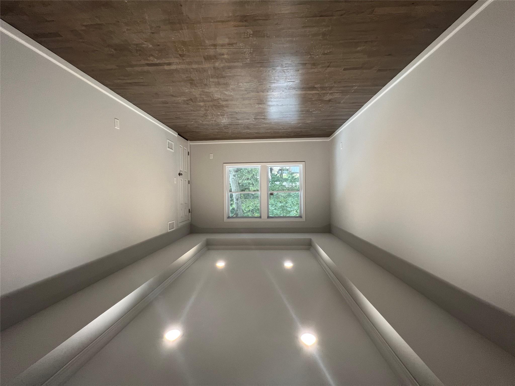 N / C Blue Point Road Farmingville, NY 11738 - Photo 14 of 16 an empty room with wooden floor and windows