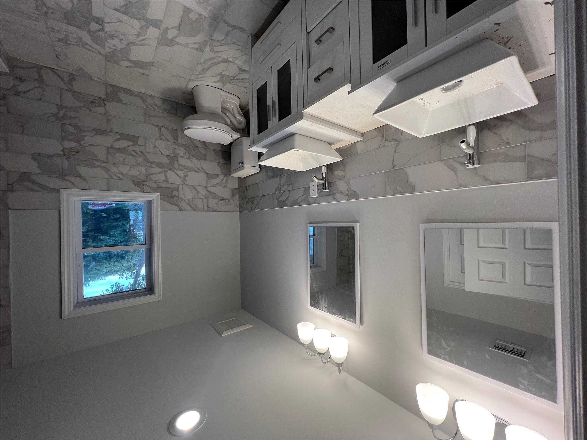 N / C Blue Point Road Farmingville, NY 11738 - Photo 15 of 16 a bathroom with a sink and a toilet