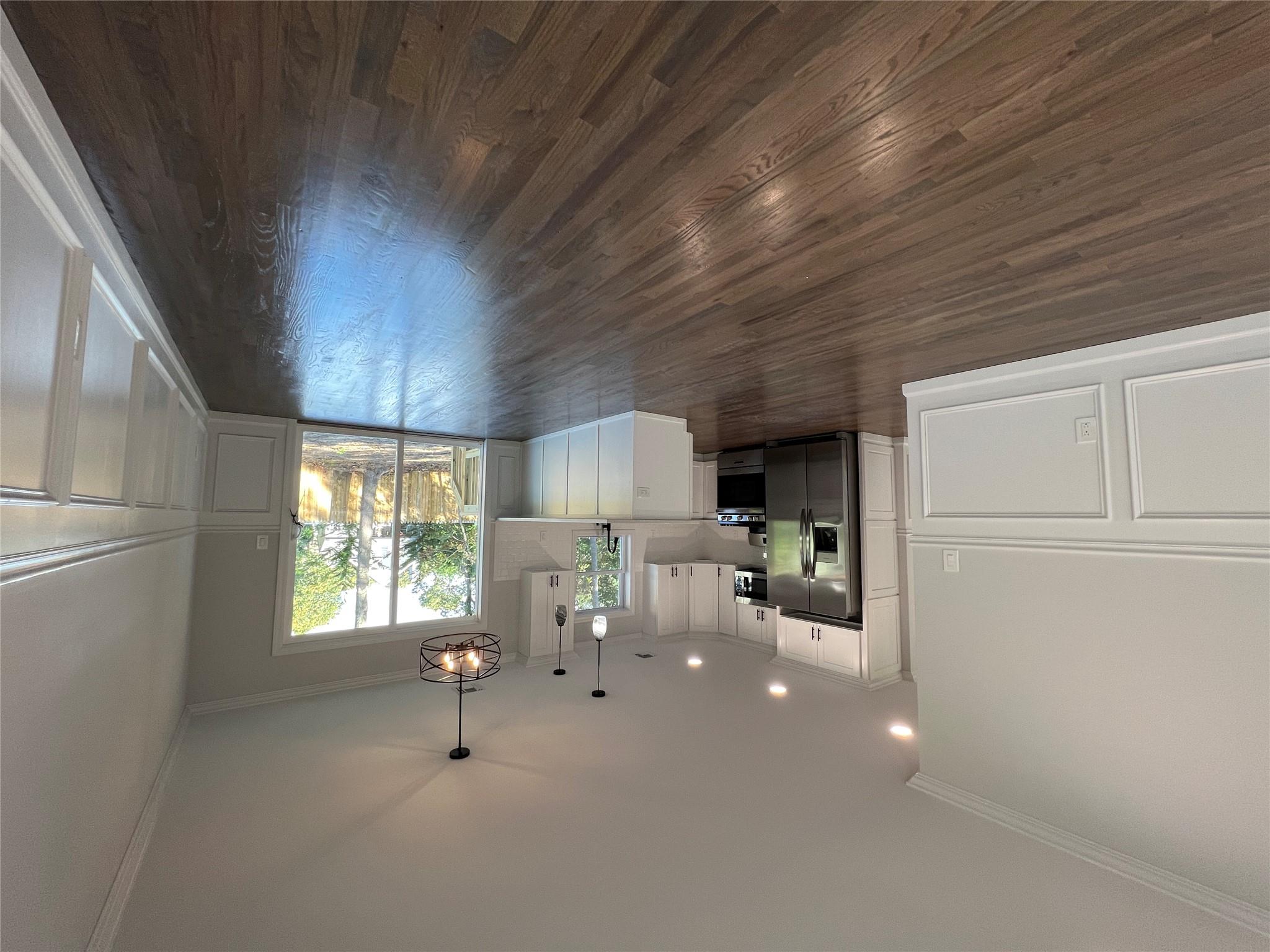 N / C Blue Point Road Farmingville, NY 11738 - Photo 3 of 16 a view of a kitchen and dining room with wooden floor