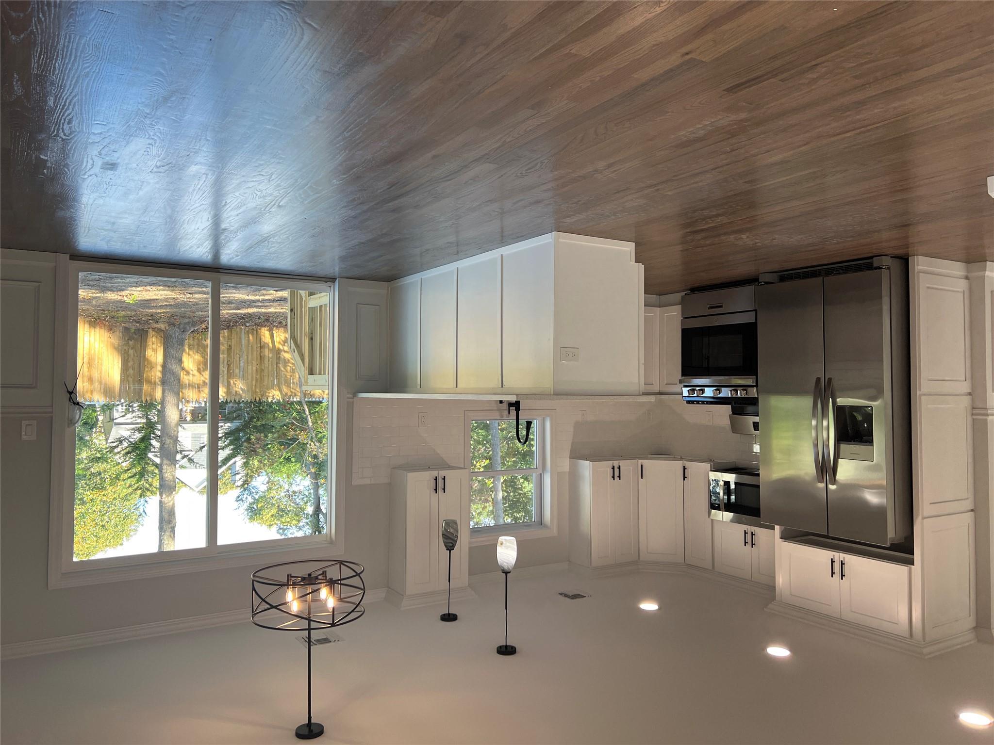 N / C Blue Point Road Farmingville, NY 11738 - Photo 4 of 16 a view of a kitchen with microwave and stove