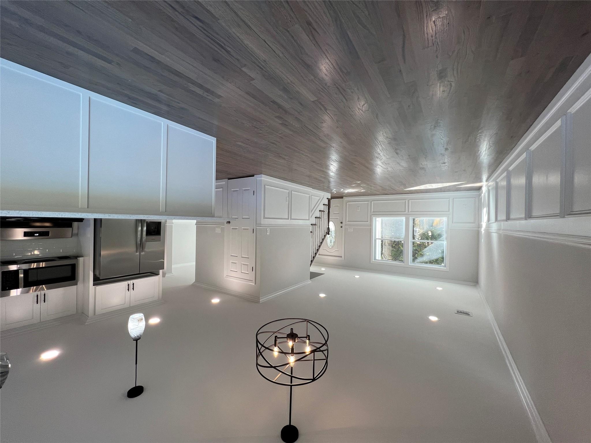 N / C Blue Point Road Farmingville, NY 11738 - Photo 6 of 16 a view of a room with wooden floor and windows