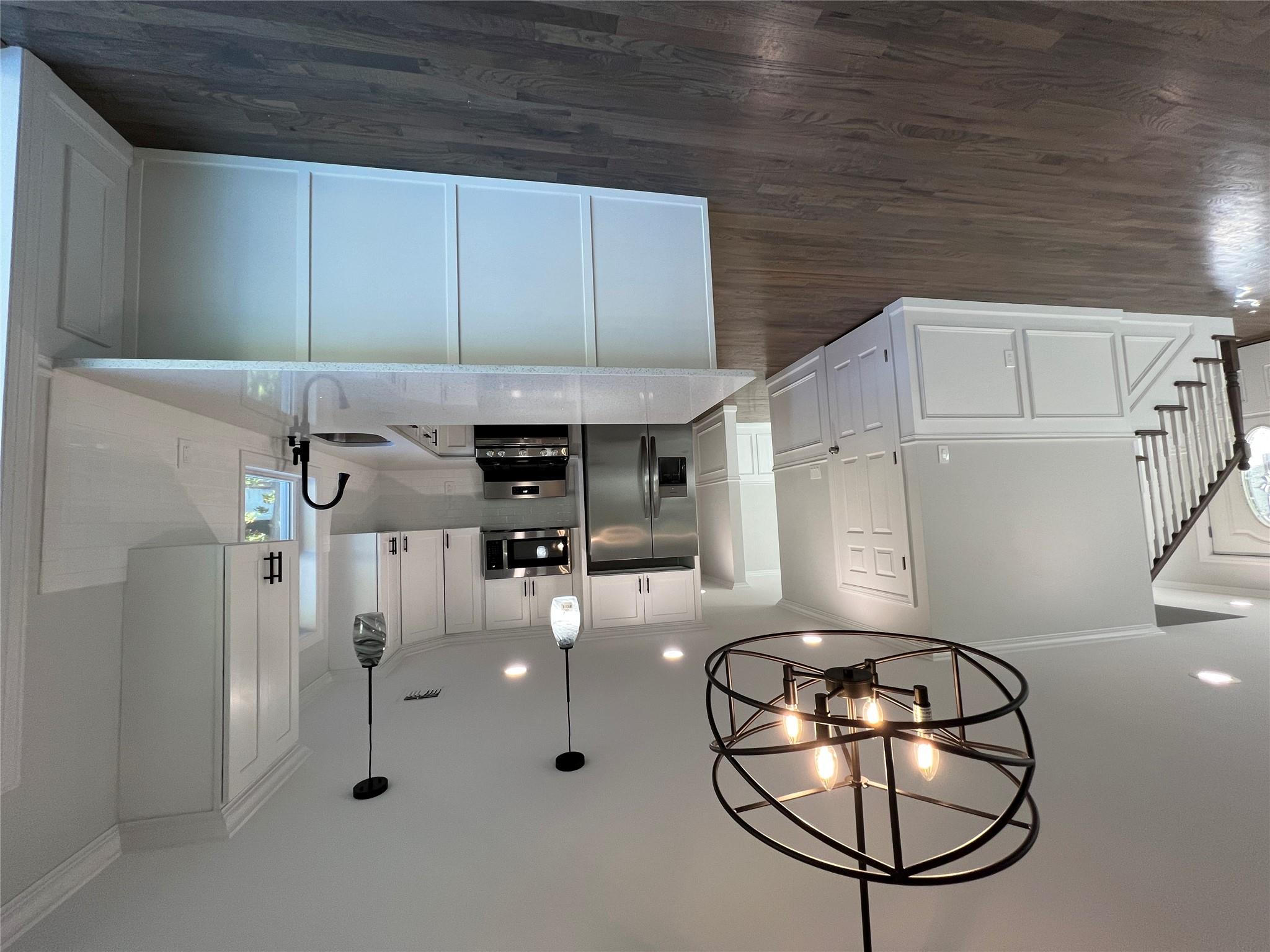 N / C Blue Point Road Farmingville, NY 11738 - Photo 7 of 16 a view of living room with wooden floor and ceiling fan