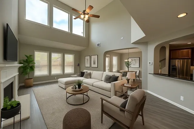a living room with furniture a fireplace and a flat screen tv