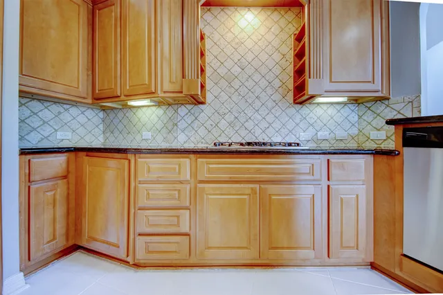 a view of a kitchen with appliances and cabinets