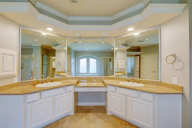 a bathroom with a granite countertop sink mirror and a