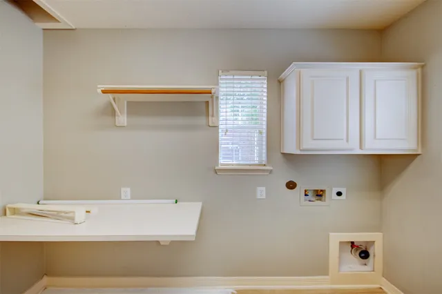 a bathroom with a bathtub and a window