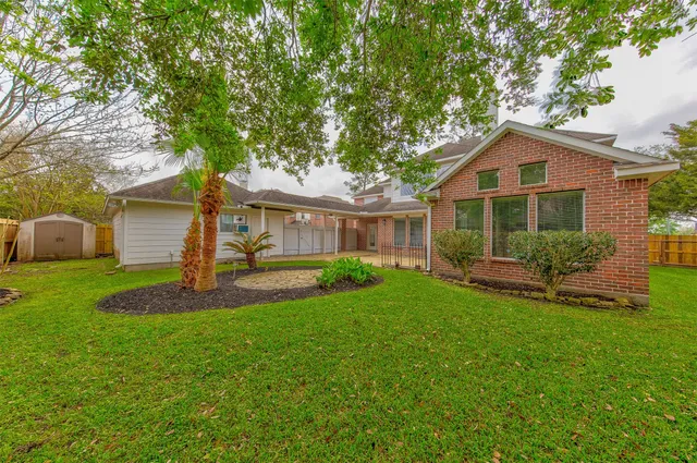 a front view of a house with a yard and porch
