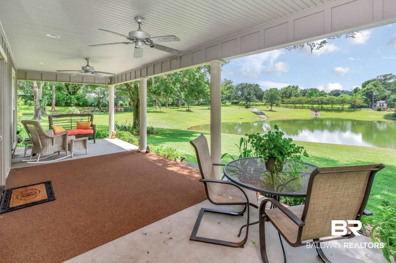 11000 Kelly Road Mobile, AL 36608 - Photo 14 of 48 Front porch of cottage overlooking stocked pond.