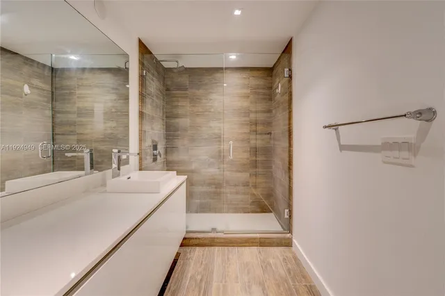 a bathroom with a shower and a tub
