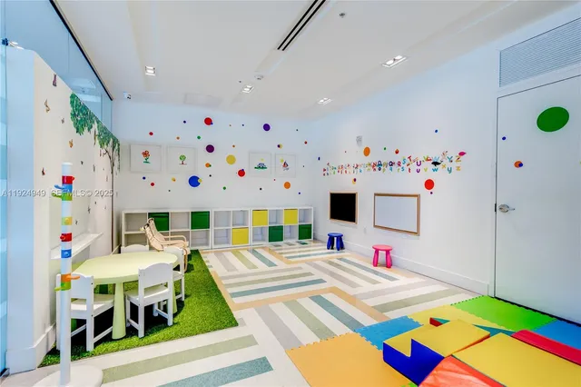 a room that has a bed and a table in it