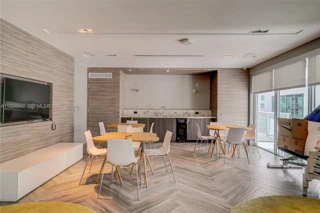 a view of a livingroom with furniture window and wooden floor