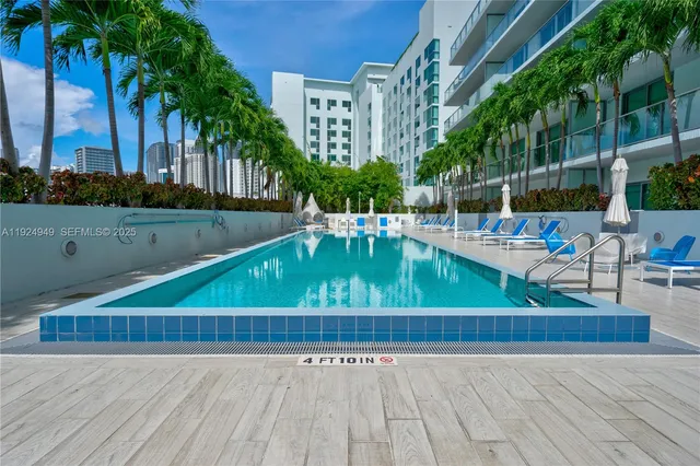 a view of a swimming pool with a patio