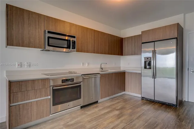 a kitchen with a sink and a microwave