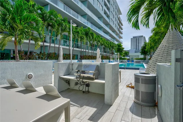 a view of a patio with couches chairs and a table and chairs