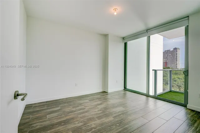 a view of livingroom with hardwood floor and hallway