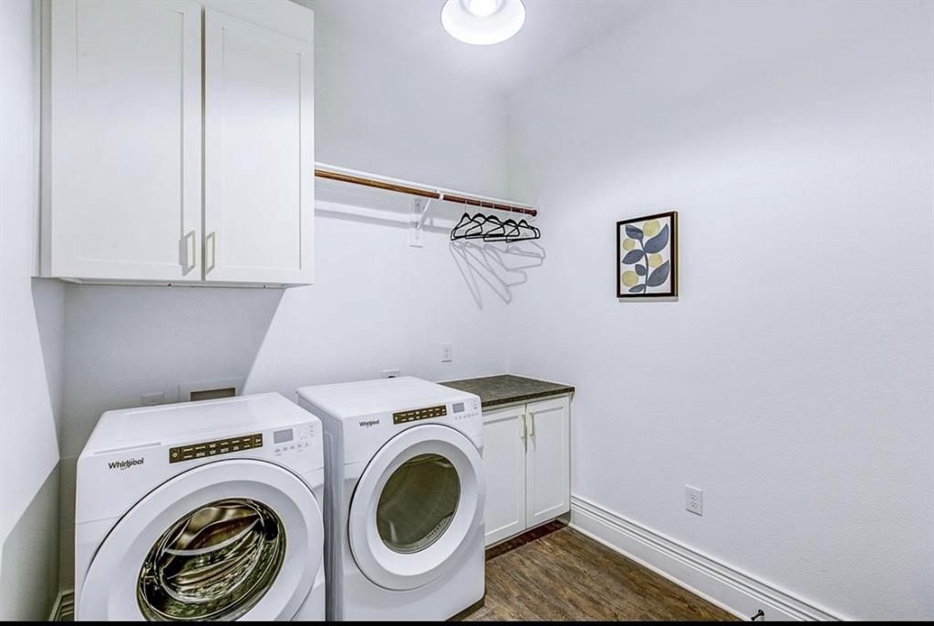12001 Inwood Road, Unit 3701 Dallas, TX 75244 - Photo 12 of 15 Washroom featuring dark hardwood / wood-style floors, cabinets, and washing machine and clothes dryer