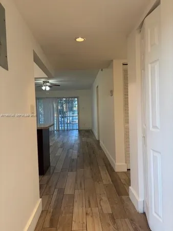 a view of entryway with wooden floor