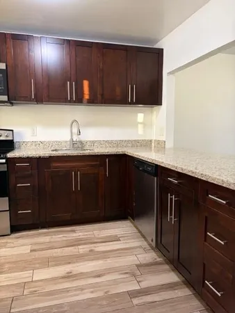 a kitchen with a sink and a cabinets