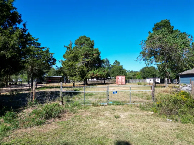 a view of a swimming pool with a yard