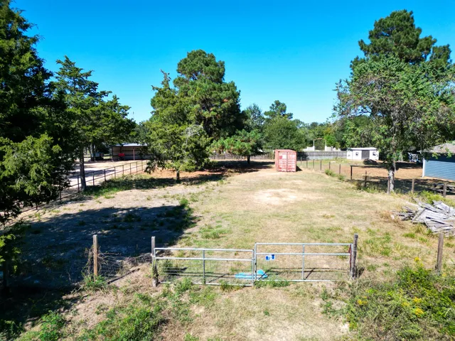 a view of a backyard with sitting area