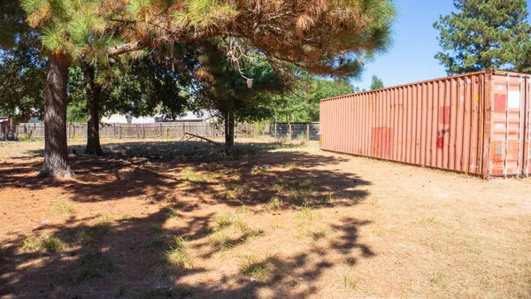 a view of a backyard of a house