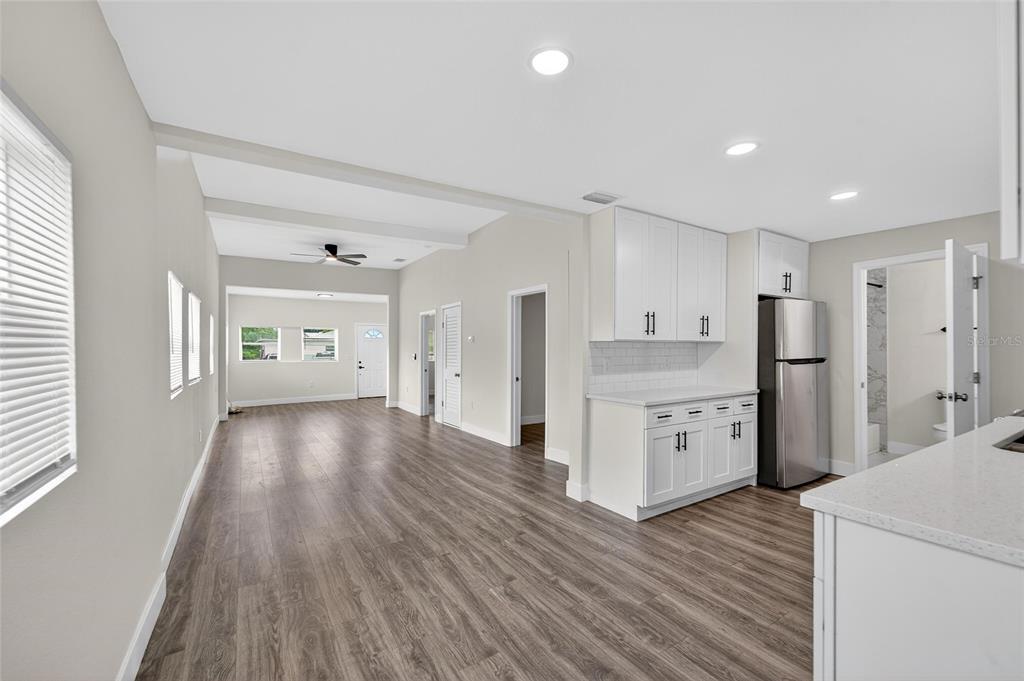 2525 West Beach Street Tampa, FL 33607 - Photo 17 of 48 a view of a kitchen with refrigerator stove and wooden floor