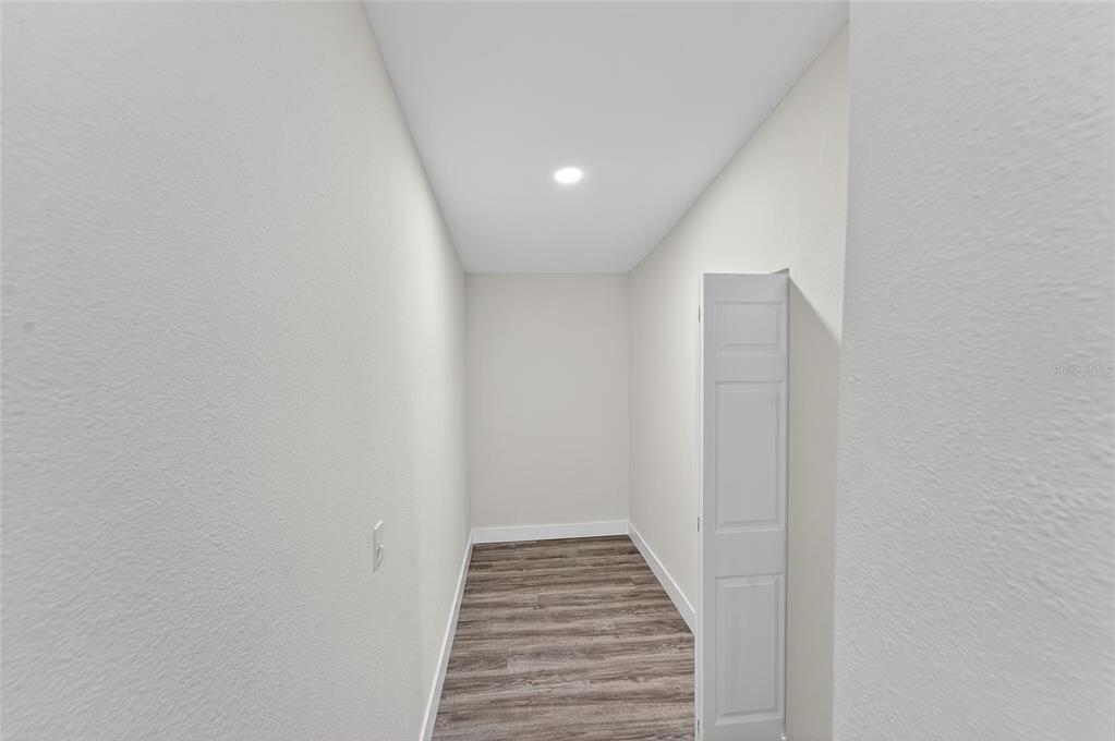 2525 West Beach Street Tampa, FL 33607 - Photo 18 of 48 a view of a hallway with wooden floor