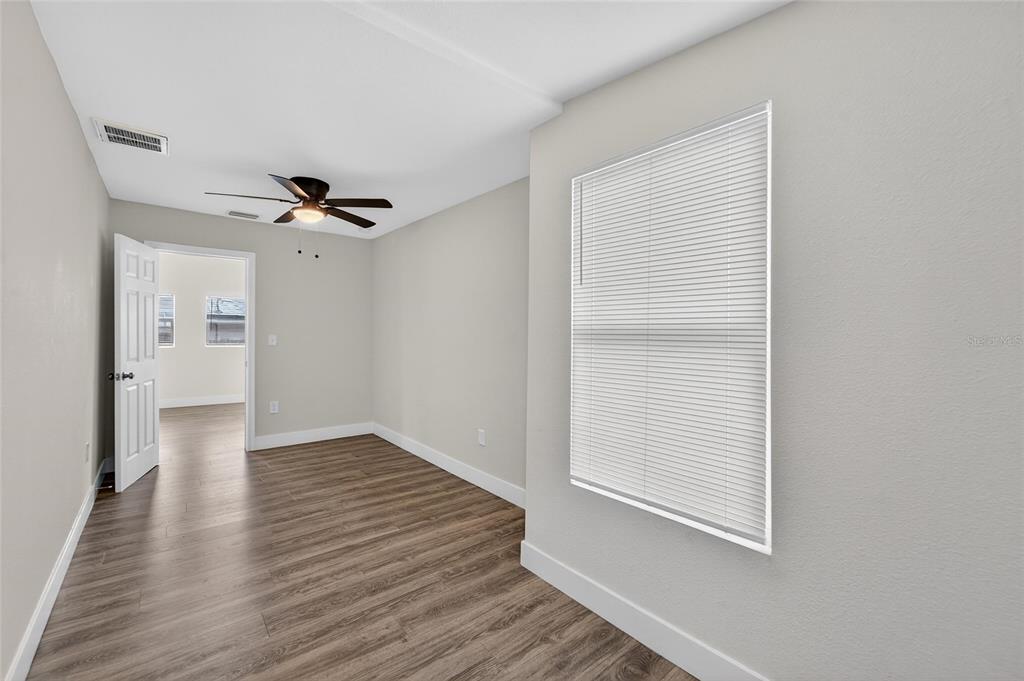 2525 West Beach Street Tampa, FL 33607 - Photo 25 of 48 a view of an empty room with wooden floor