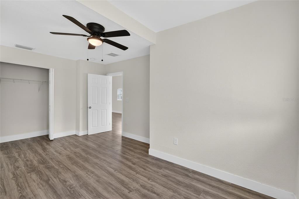 2525 West Beach Street Tampa, FL 33607 - Photo 28 of 48 a view of a big room with wooden floor closet and windows