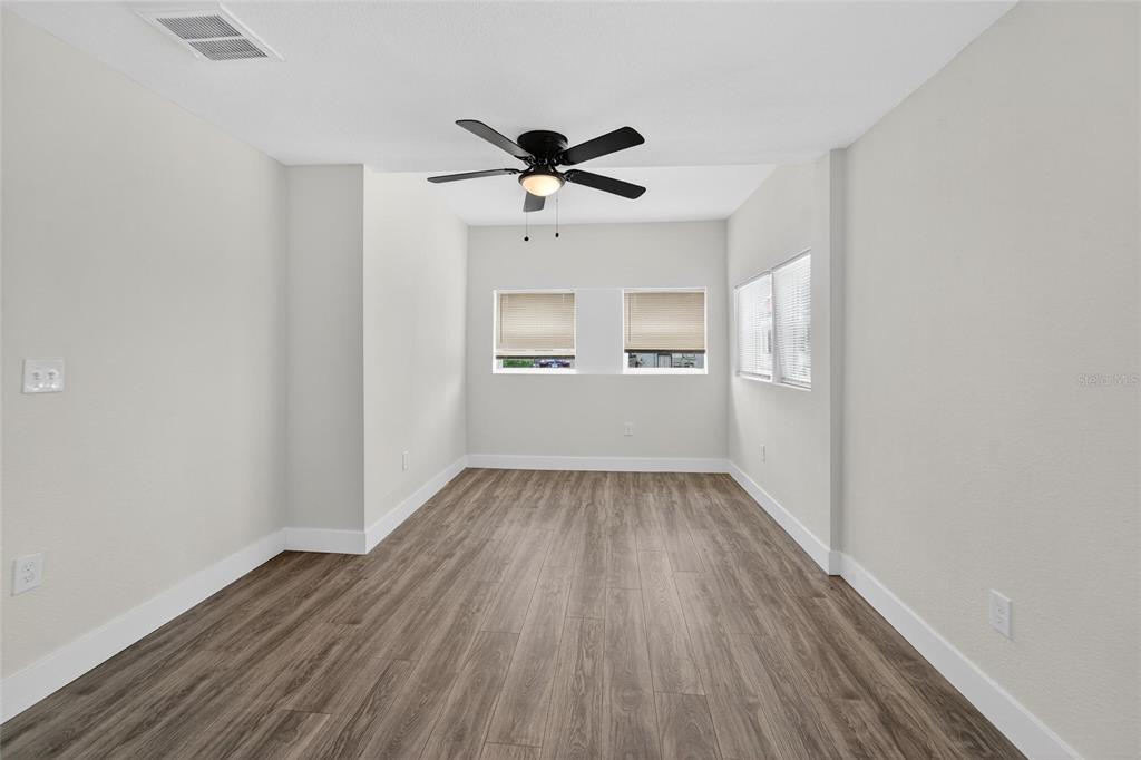 2525 West Beach Street Tampa, FL 33607 - Photo 29 of 48 wooden floor in an empty room with a window