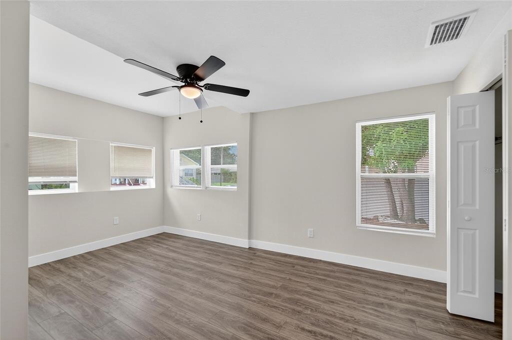 2525 West Beach Street Tampa, FL 33607 - Photo 30 of 48 a view of an empty room with a window and wooden floor