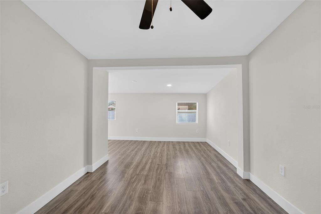 2525 West Beach Street Tampa, FL 33607 - Photo 32 of 48 wooden floor in an empty room with a window