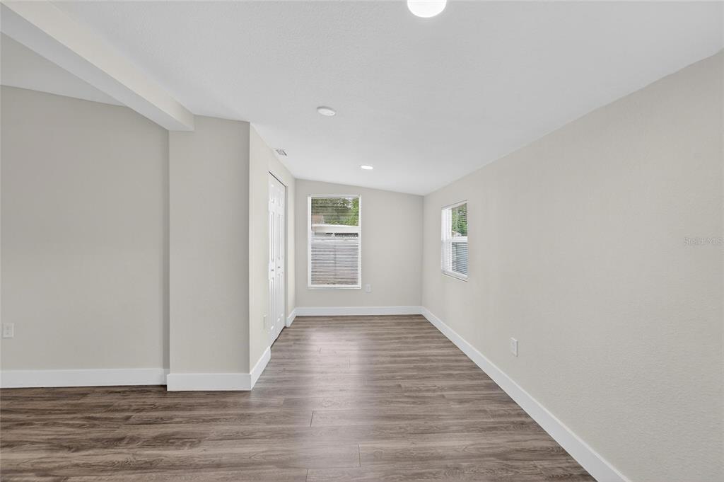 2525 West Beach Street Tampa, FL 33607 - Photo 34 of 48 a view of an empty room with wooden floor
