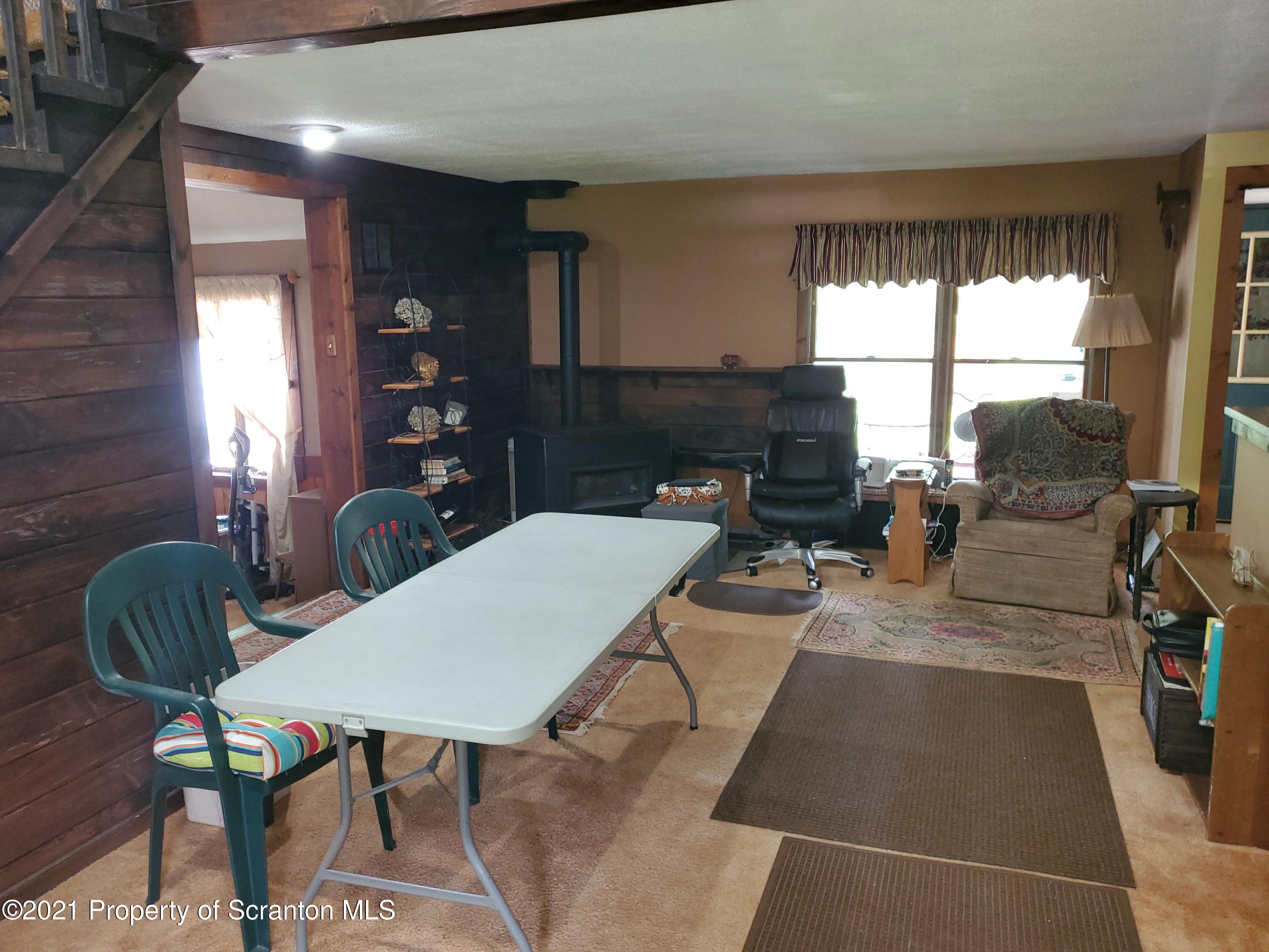1280 Mitchell Road Montrose, PA 18801 - Photo 7 of 28 a living room with furniture and a large window
