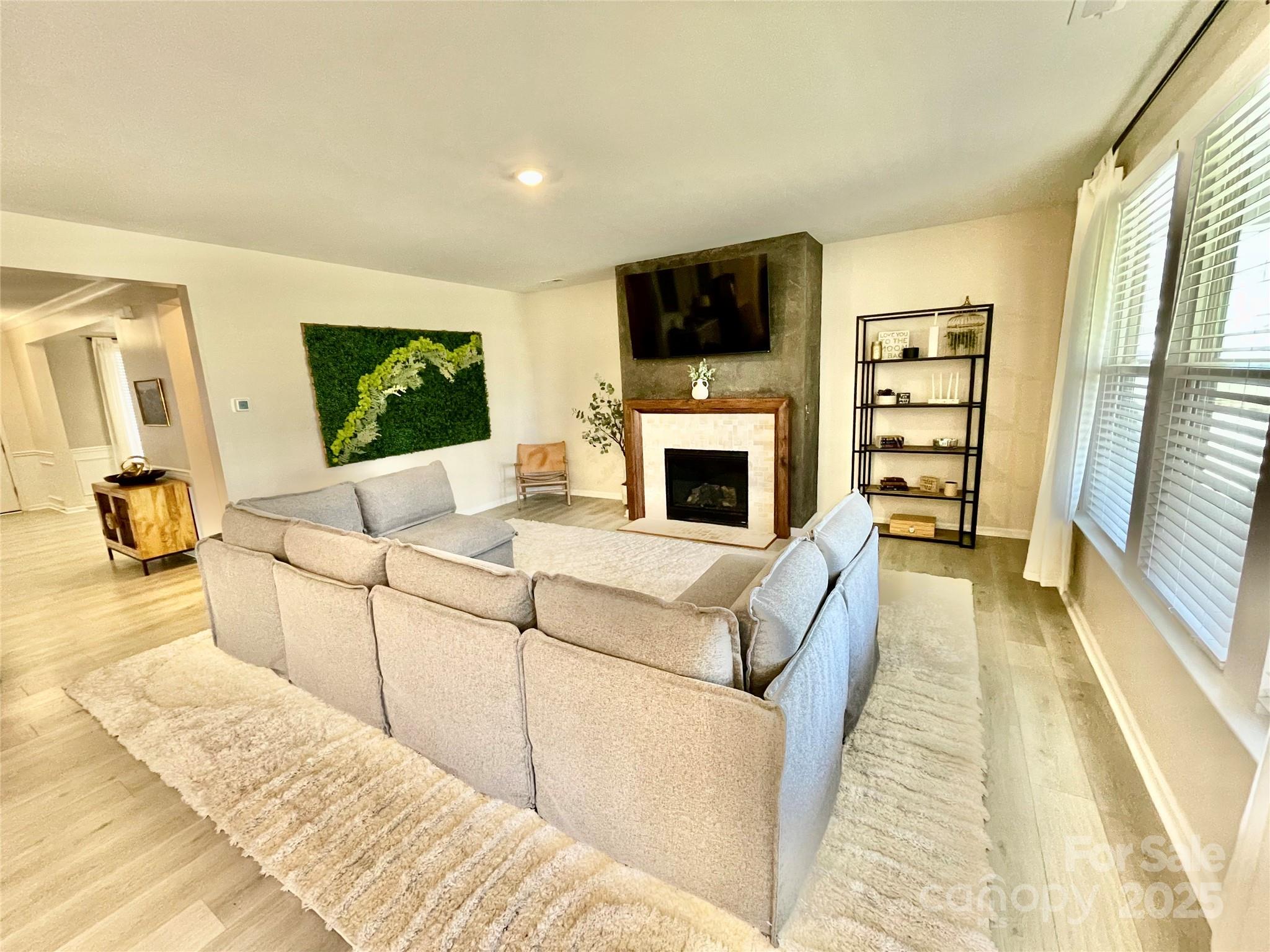 278 West Waterlynn Road Mooresville, NC 28117 - Photo 15 of 46 a living room with furniture and a flat screen tv
