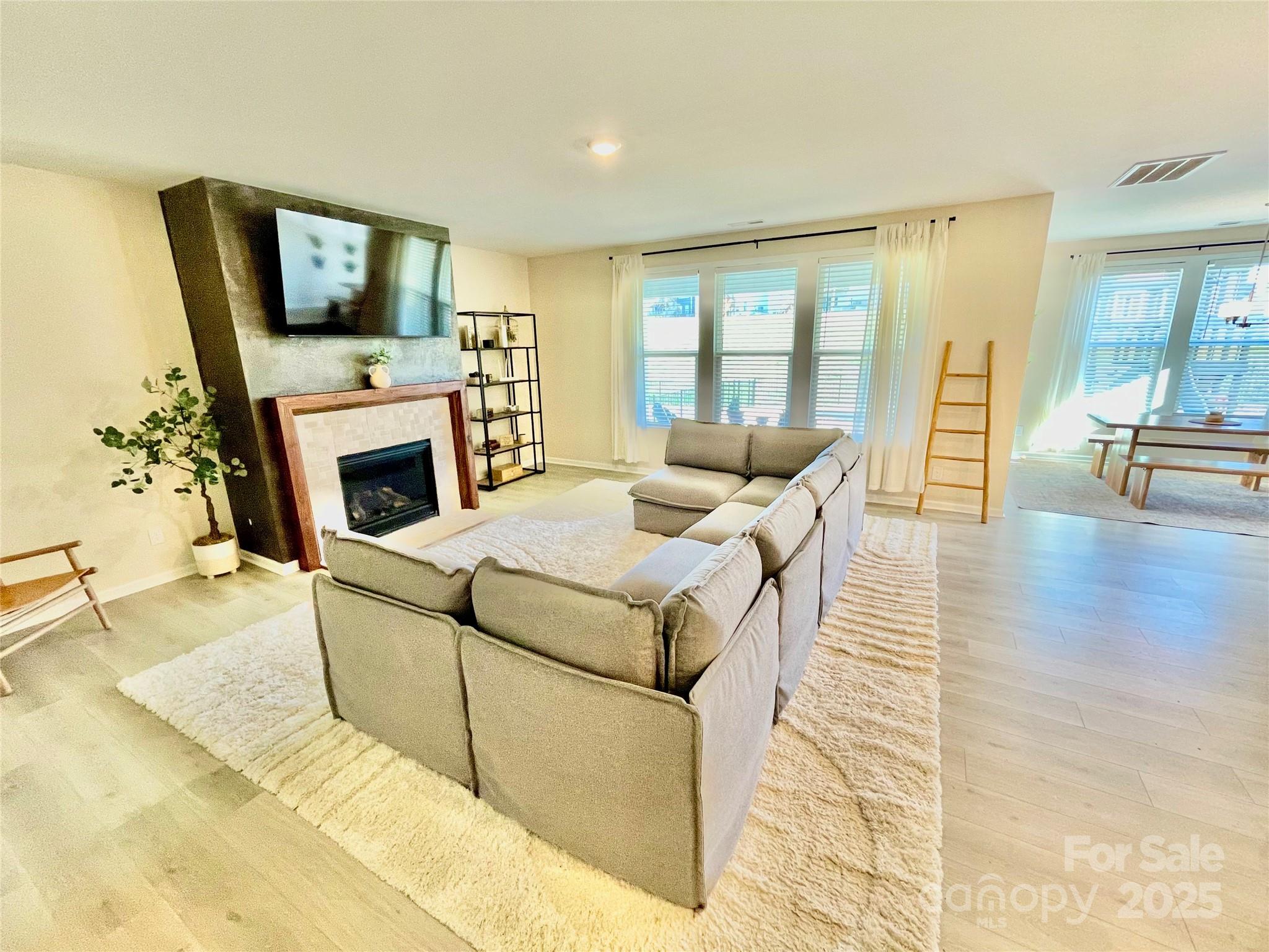 278 West Waterlynn Road Mooresville, NC 28117 - Photo 16 of 46 a living room with furniture and a fireplace