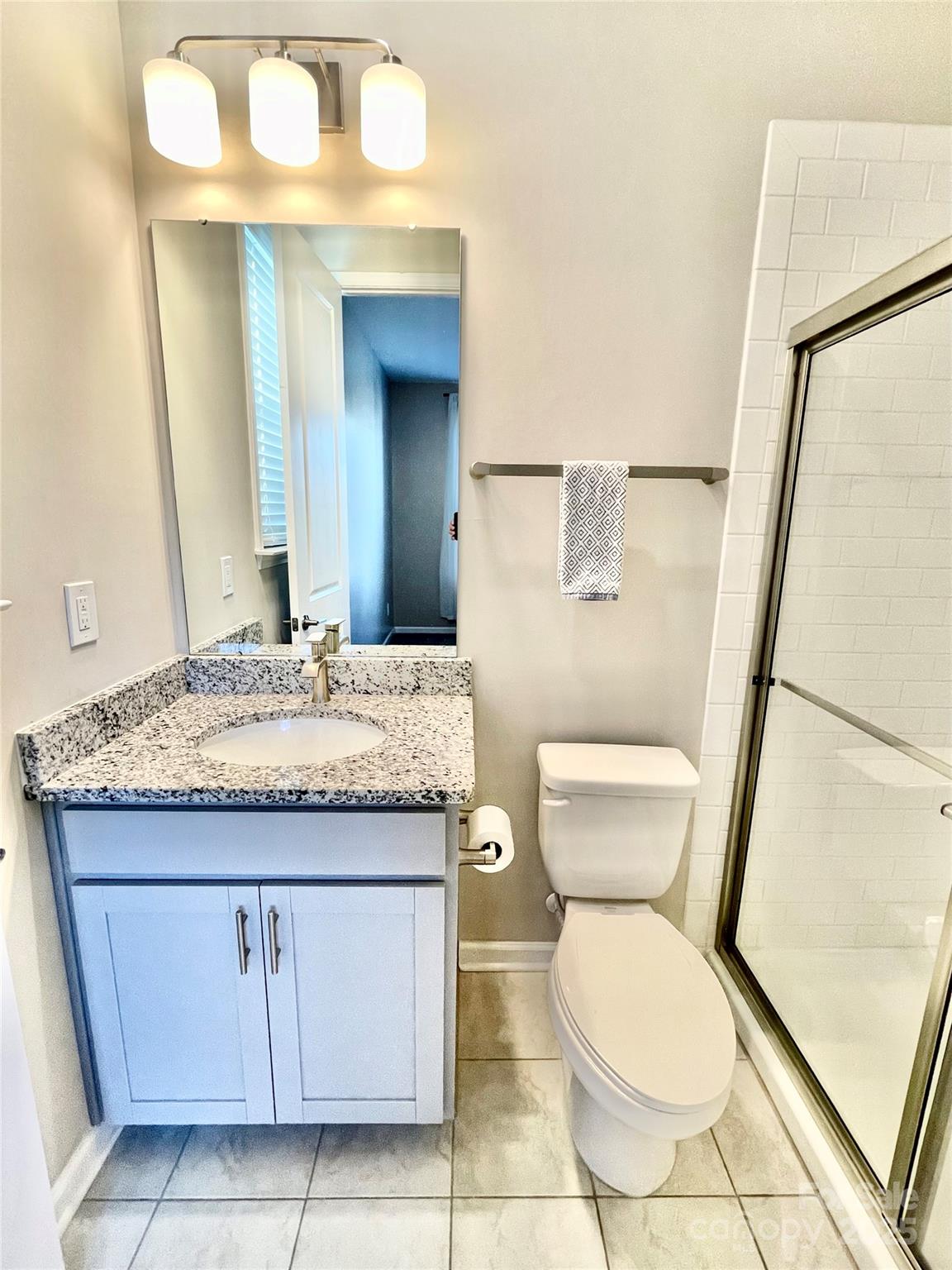 278 West Waterlynn Road Mooresville, NC 28117 - Photo 22 of 46 a bathroom with a granite countertop toilet and a sink