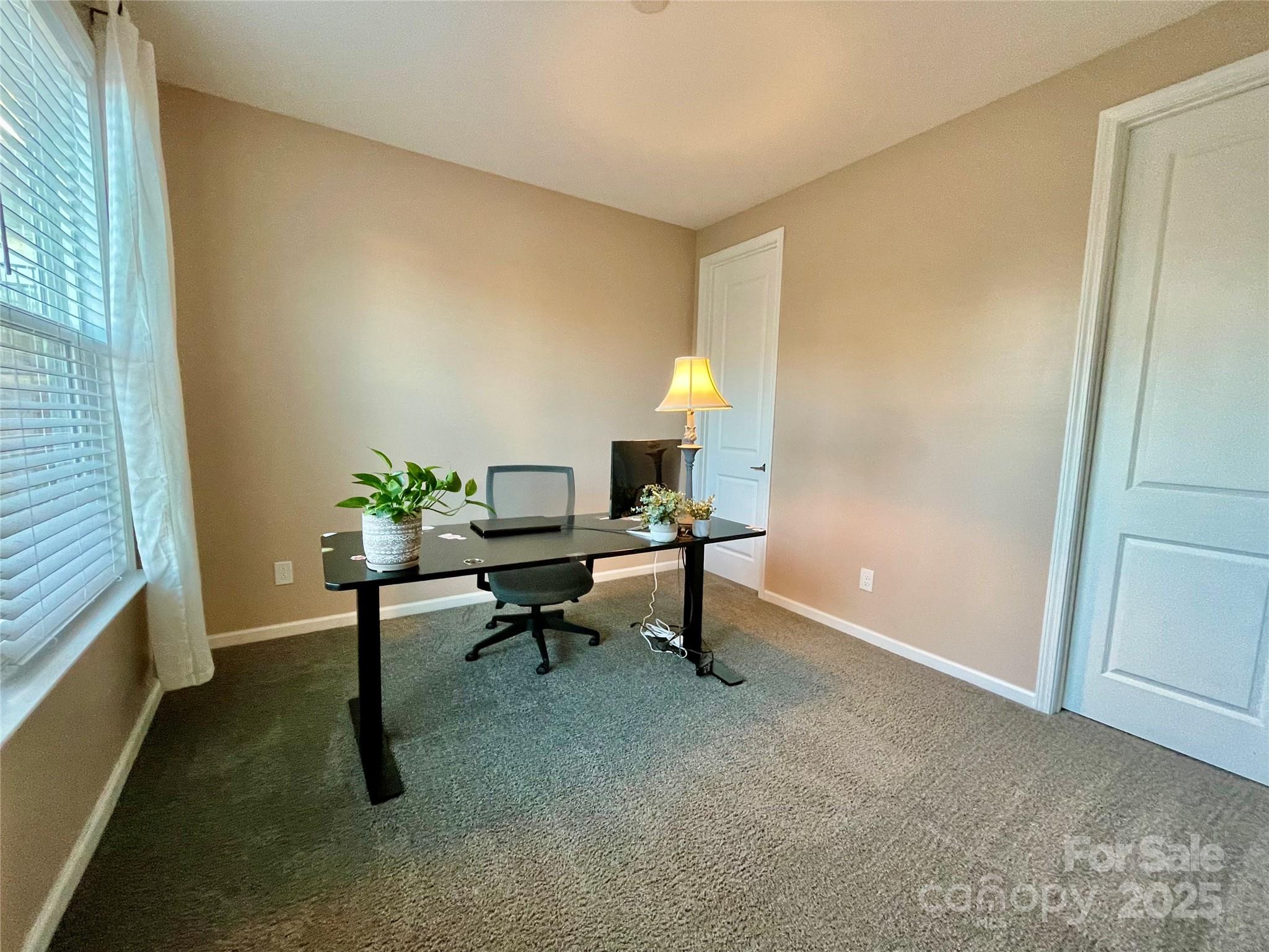 278 West Waterlynn Road Mooresville, NC 28117 - Photo 23 of 46 a view of a workspace with furniture and a window