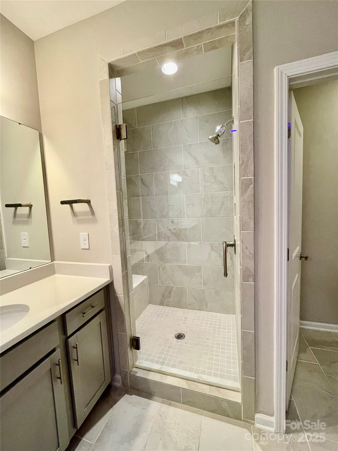 278 West Waterlynn Road Mooresville, NC 28117 - Photo 29 of 46 a bathroom with a shower sink and mirror