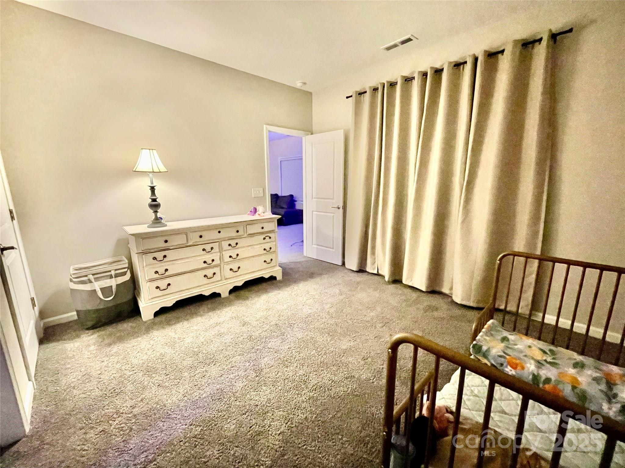 278 West Waterlynn Road Mooresville, NC 28117 - Photo 33 of 46 a spacious bedroom with a bed and a window