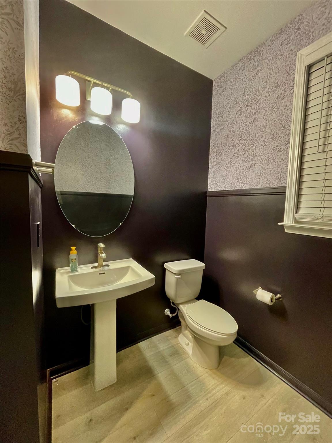 278 West Waterlynn Road Mooresville, NC 28117 - Photo 34 of 46 a bathroom with a toilet sink and mirror