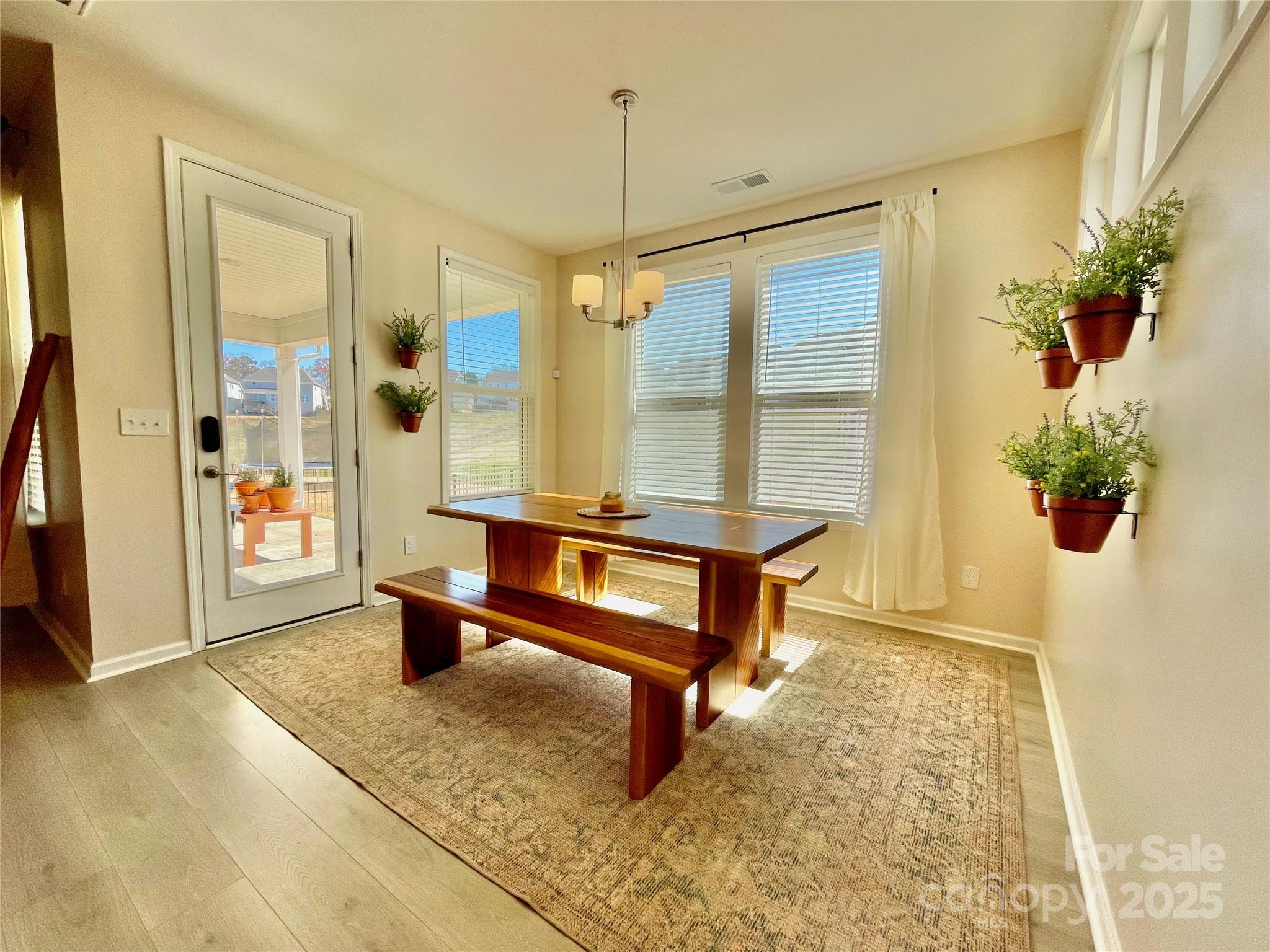 278 West Waterlynn Road Mooresville, NC 28117 - Photo 8 of 46 a living room with furniture and a potted plant