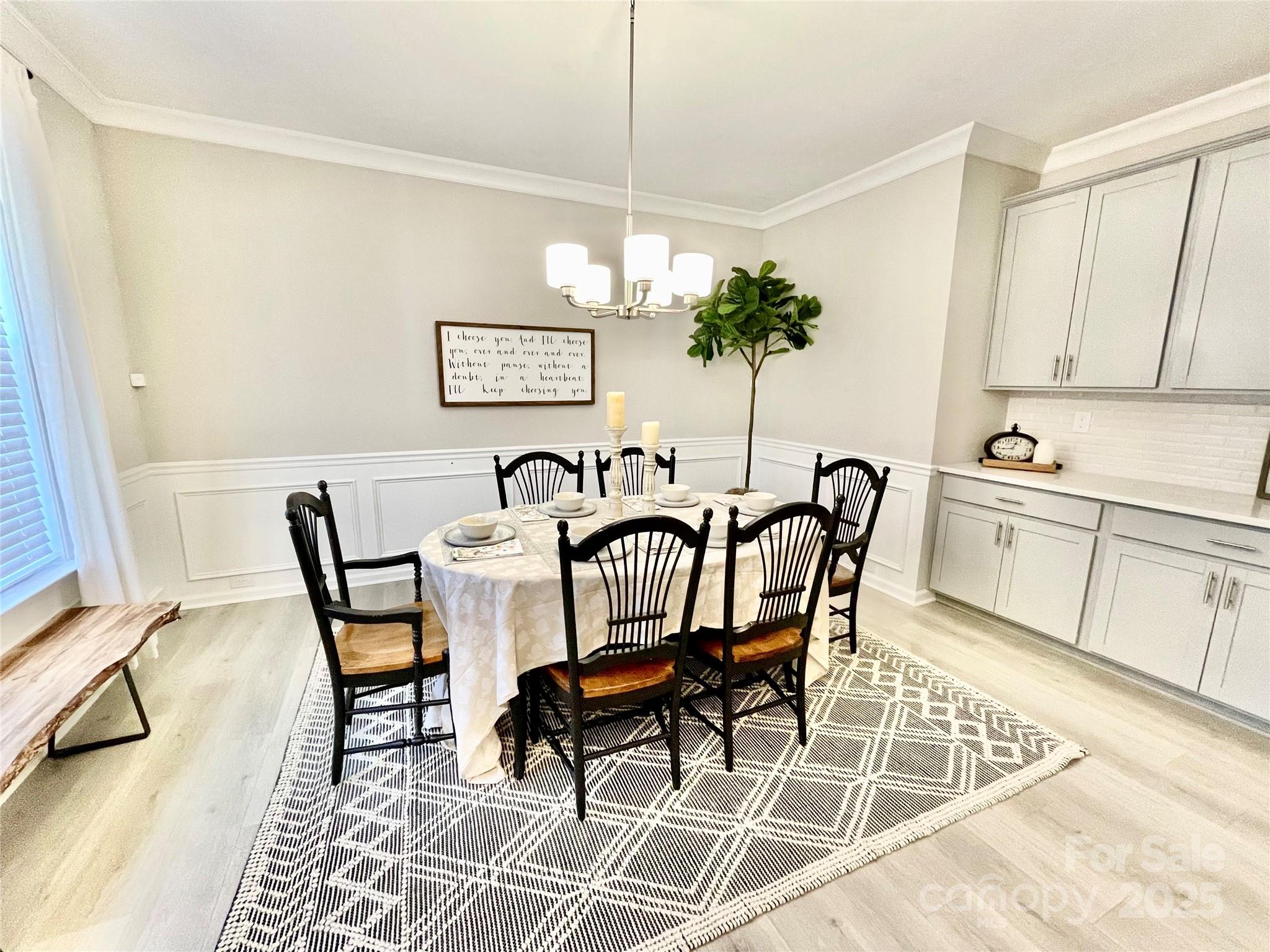 278 West Waterlynn Road Mooresville, NC 28117 - Photo 10 of 46 a view of a dining room with furniture and a chandelier