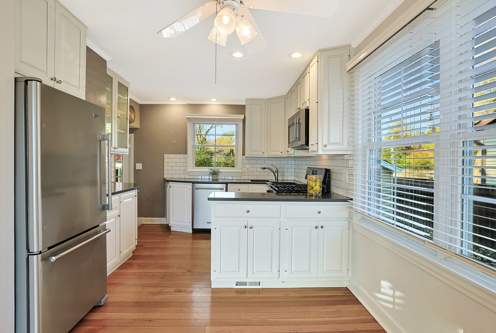 120 South Rohlwing Road Palatine, IL 60074 - Photo 12 of 49 a kitchen with stainless steel appliances a refrigerator sink and cabinets