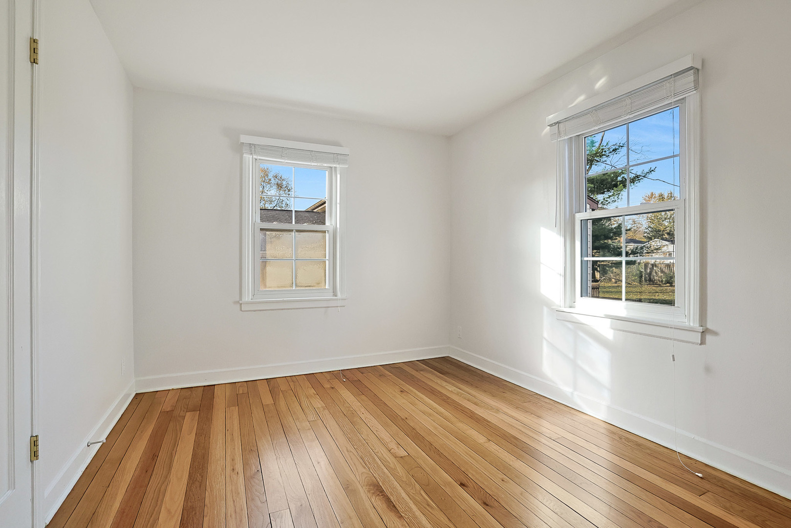 120 South Rohlwing Road Palatine, IL 60074 - Photo 17 of 49 a view of empty room with wooden floor and fan