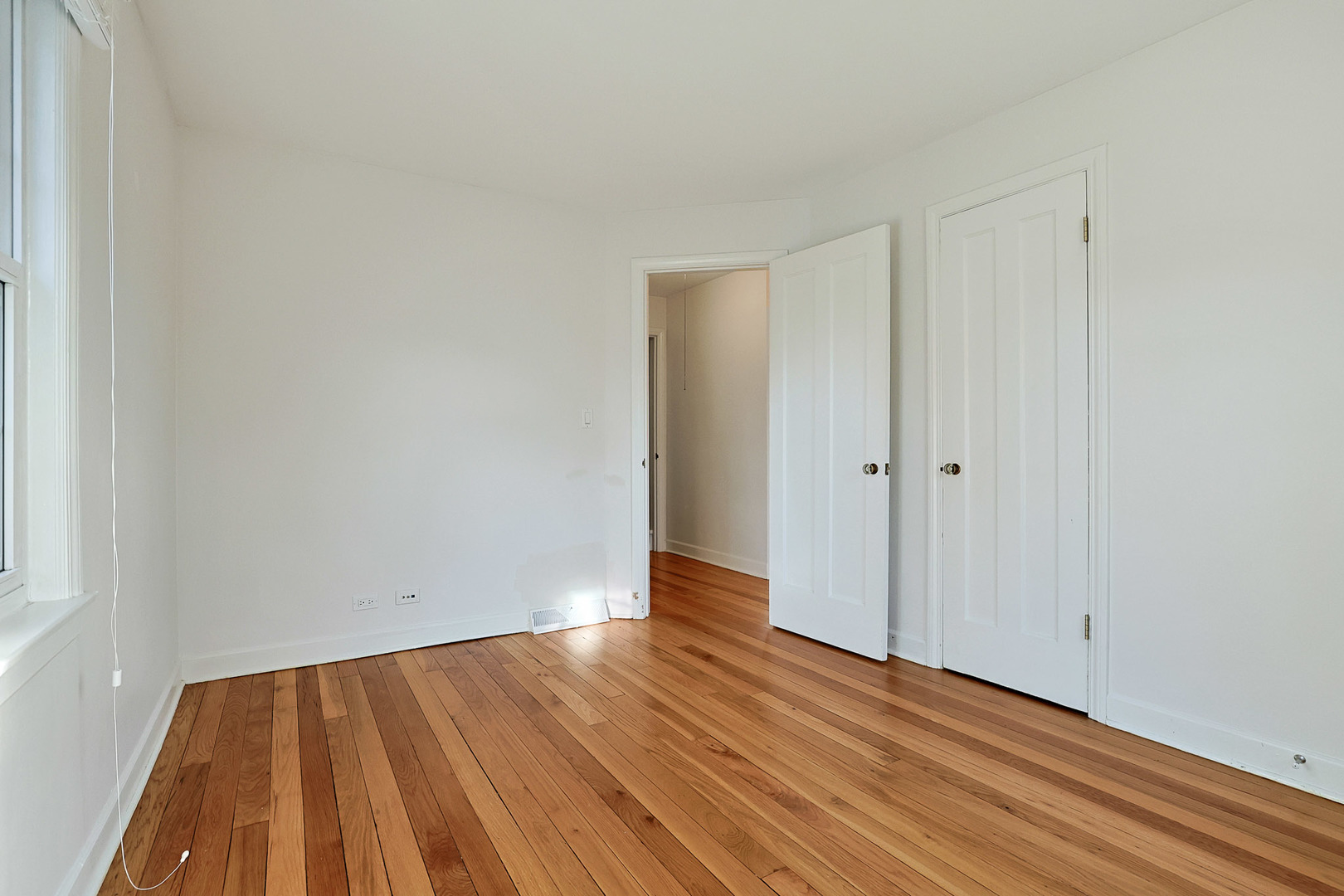 120 South Rohlwing Road Palatine, IL 60074 - Photo 18 of 49 a view of an empty room with wooden floor